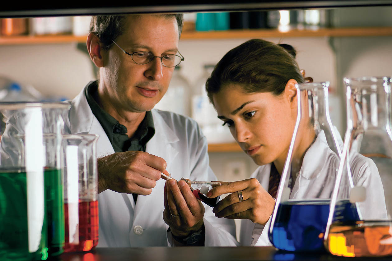 Paul Frymier with a student in a lab.