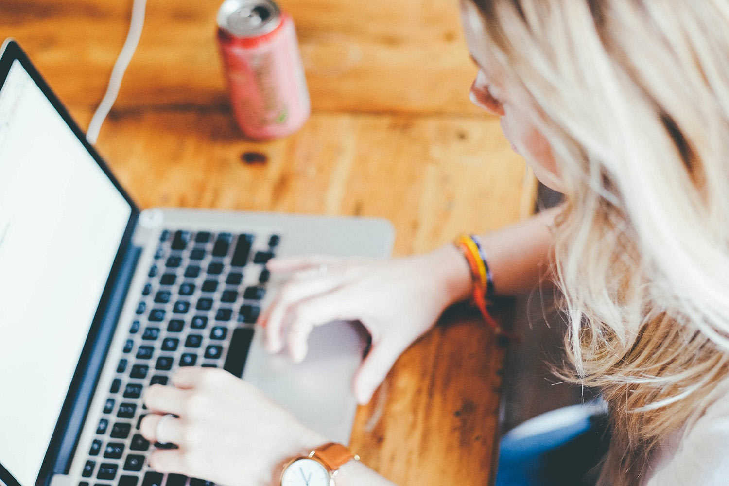 A woman uses a laptop.