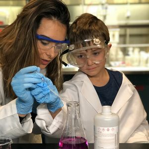 Jess Ossyra and her son, John Emerson, in a lab.