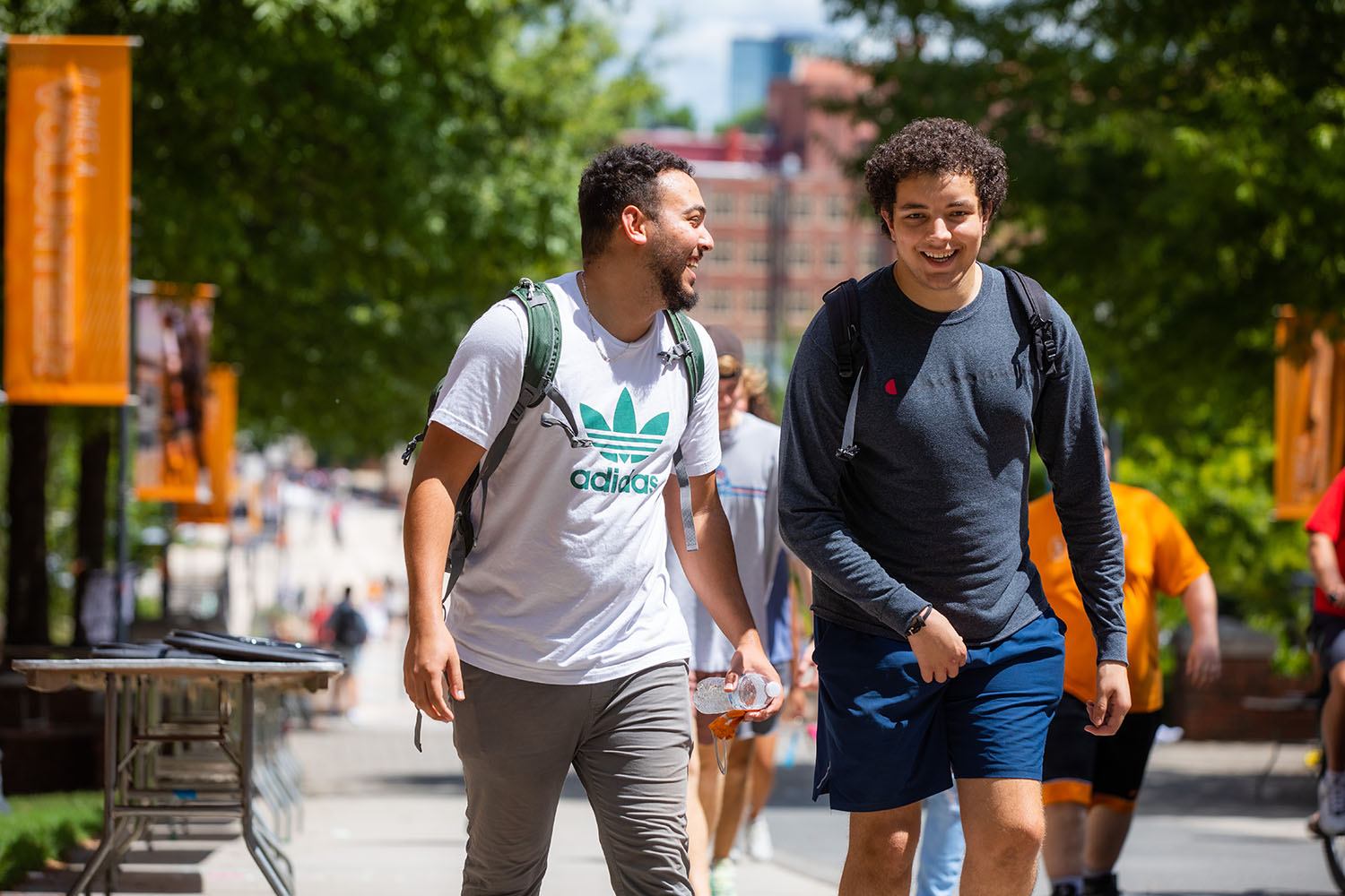 Two students walk on the pedestrian walkway.