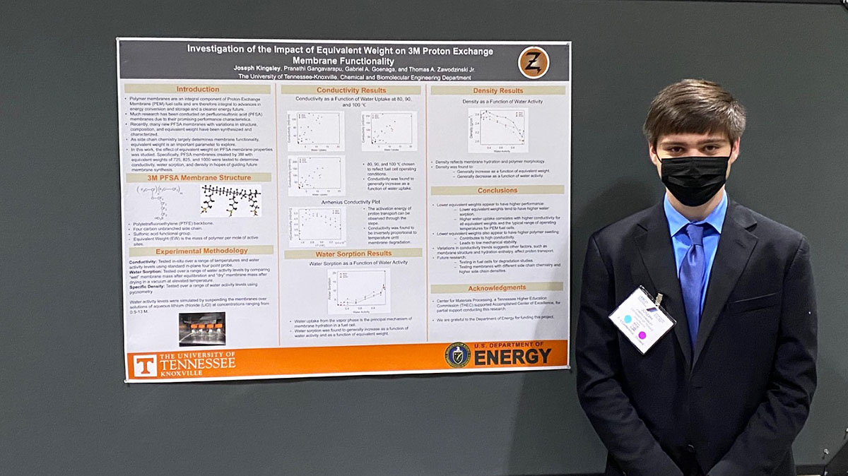 Joseph Kingsley with poster at the AIChE conference.