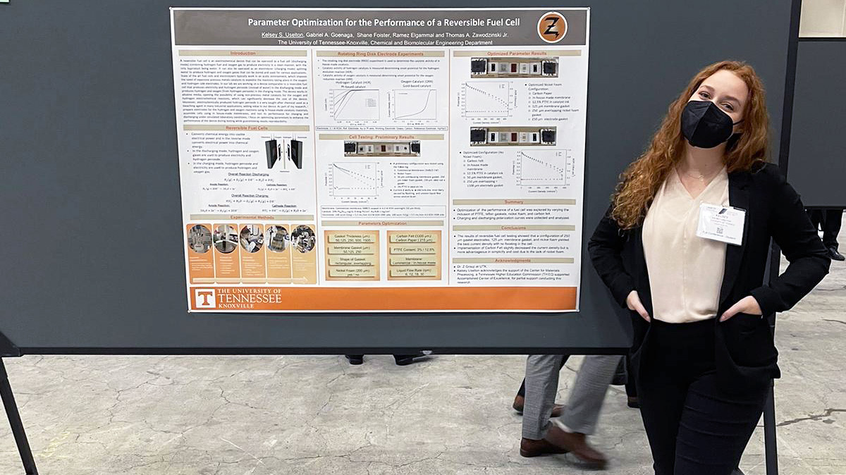 Kelsey Uselton with poster at the AIChE conference.