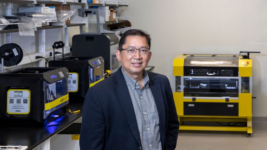 UT-ORNL Governor's Chair of Advanced and Nanostructured Materials Rigoberto Advincula standing among lab equipment