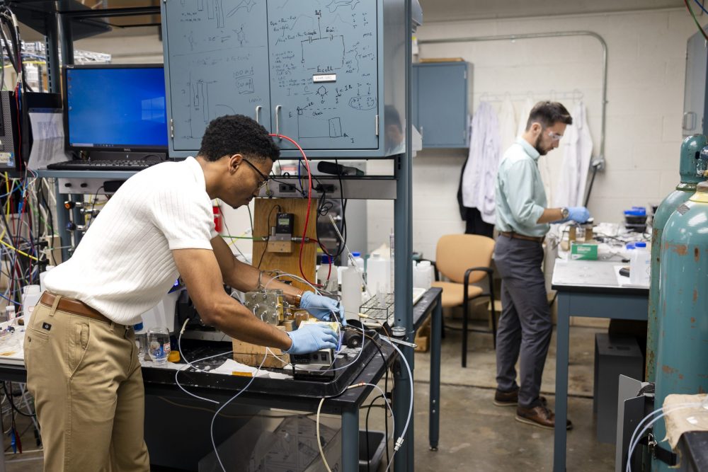 Colt Griffith and Brian Washington working in a lab on their startup company AluminAiry