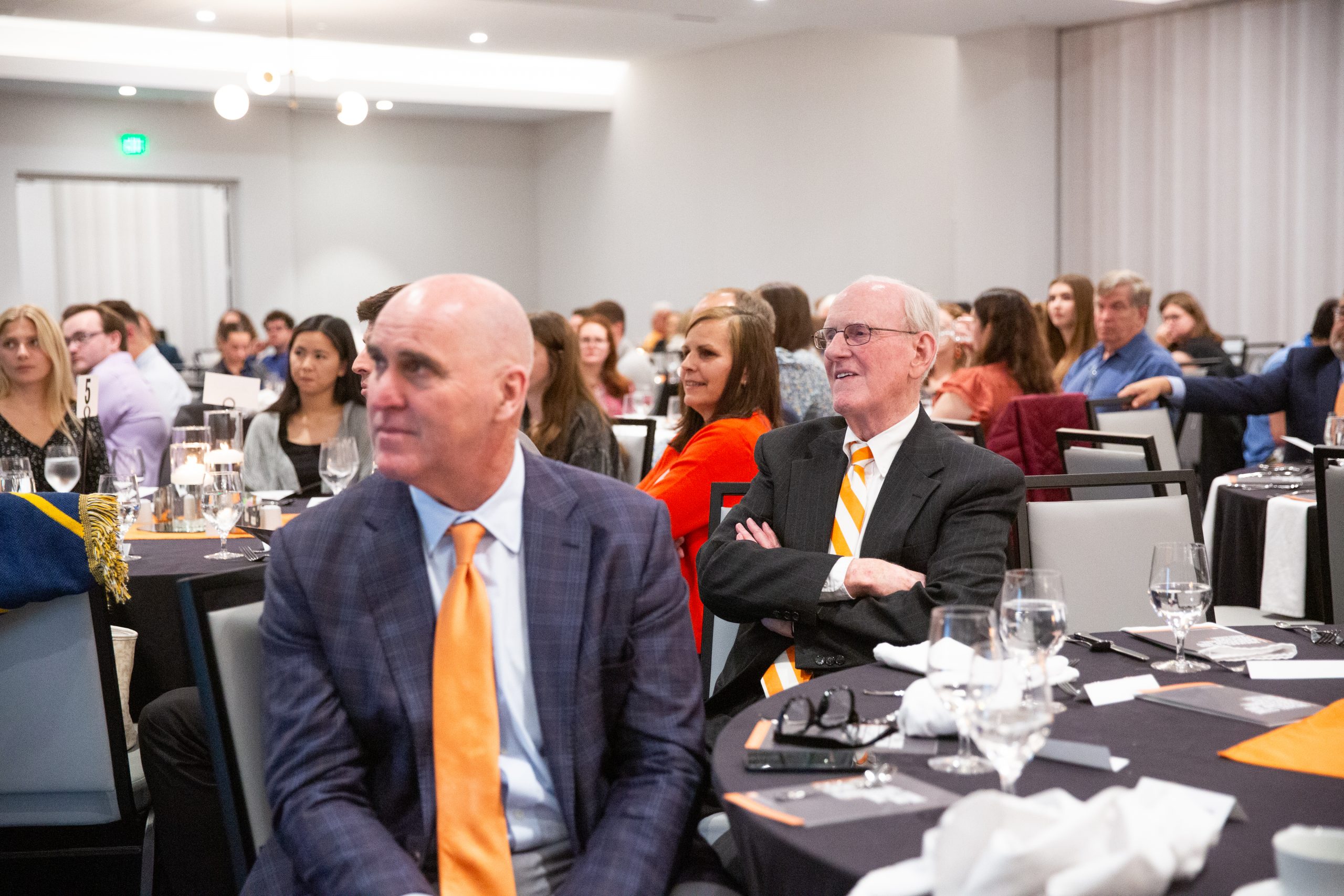 Mike Stone and Scott sitting at a banquet