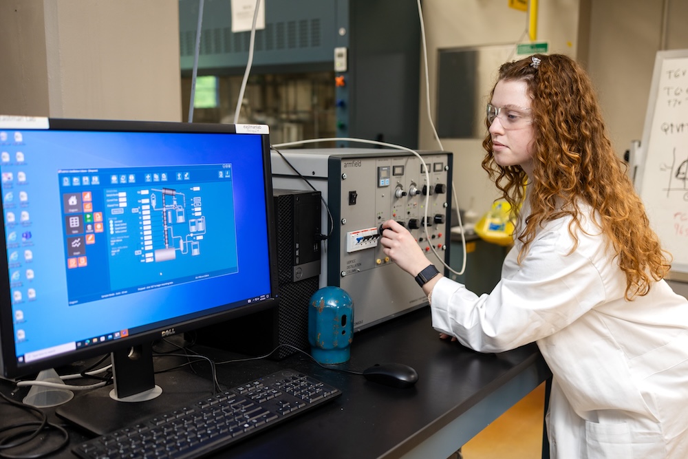 student running experiments with a computer in the Eastman lab