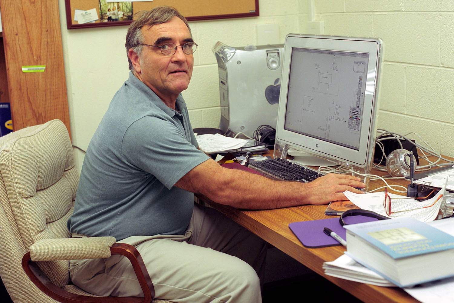 Charles Moore sits at a computer.